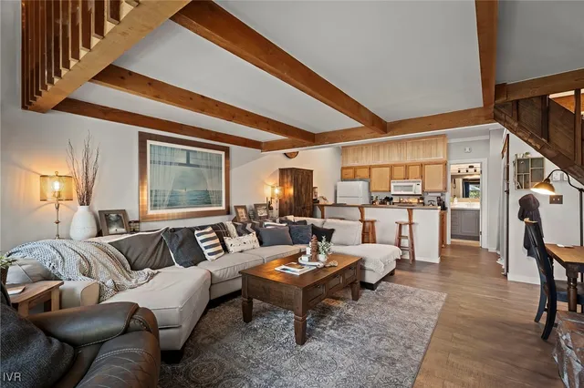 a kitchen with a stove a refrigerator and a stove top oven