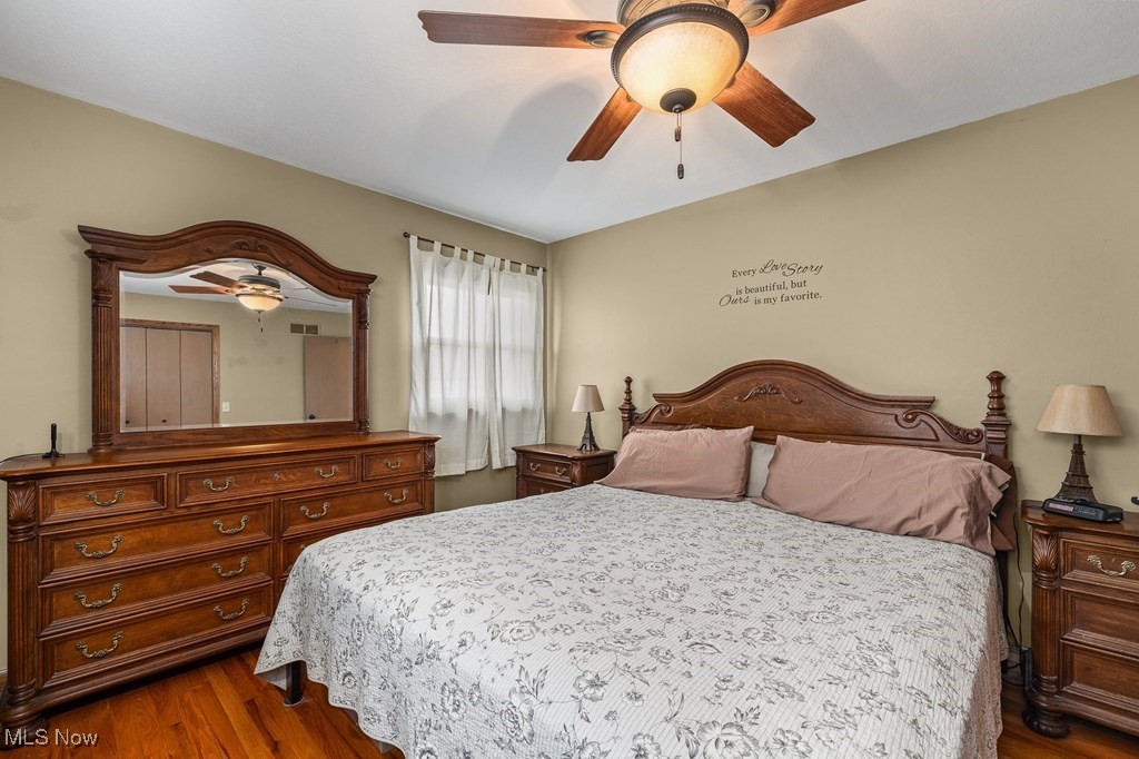 8238 Ruff Road West Salem, OH 44287 - Photo 16 of 27 Bedroom with dark wood-style floors and ceiling fan