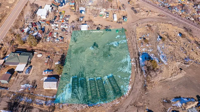 an aerial view of a house with a yard