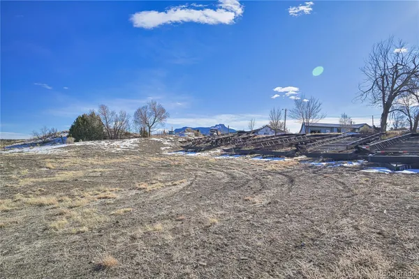 a view of a backyard of the house
