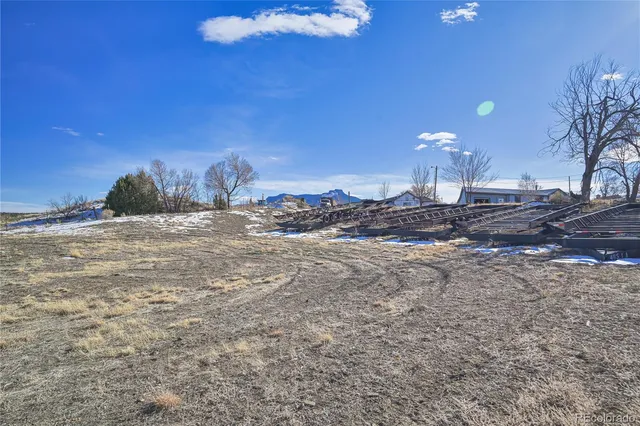 a view of a backyard of the house