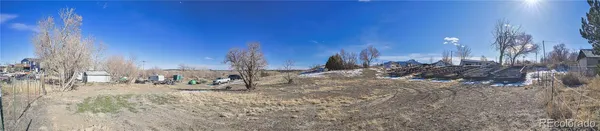 a view of a yard with large trees