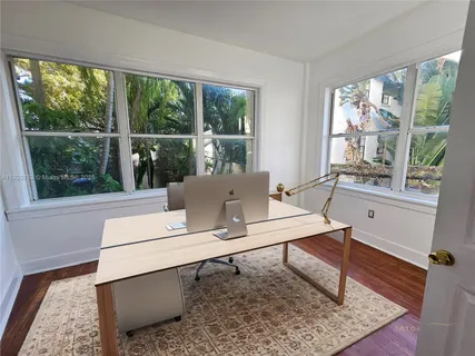 a workspace with furniture and a window