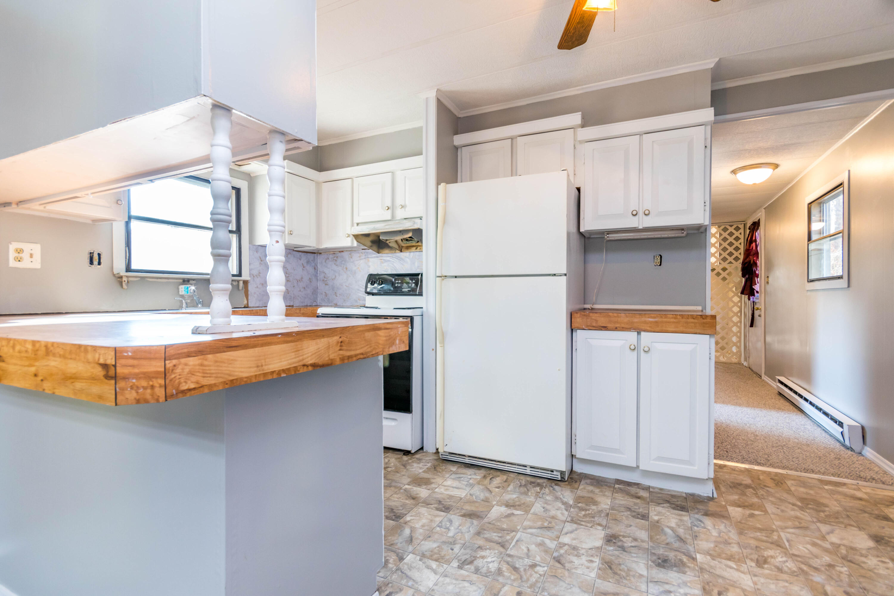 146 Windswept Road West Wareham, MA 02576 - Photo 12 of 30 a kitchen with a refrigerator a sink and a refrigerator