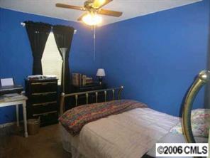 1269 Liberty Road Chester, SC 29706 - Photo 5 of 8 a bedroom with a bed and a chandelier