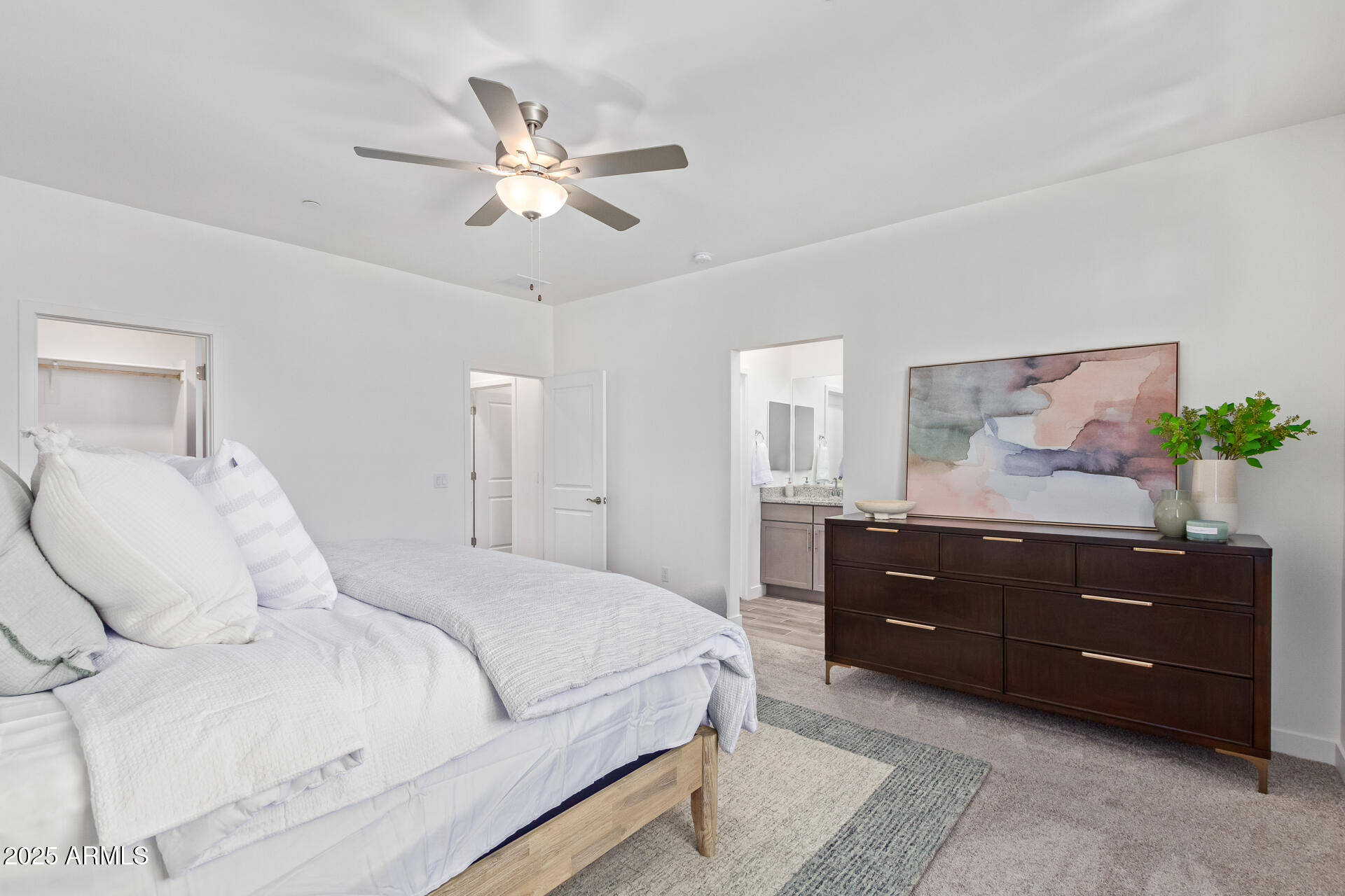 3230 East Thomas Road, Unit 184 Mesa, AZ 85213 - Photo 18 of 30 a bedroom with a bed and lamp on dresser