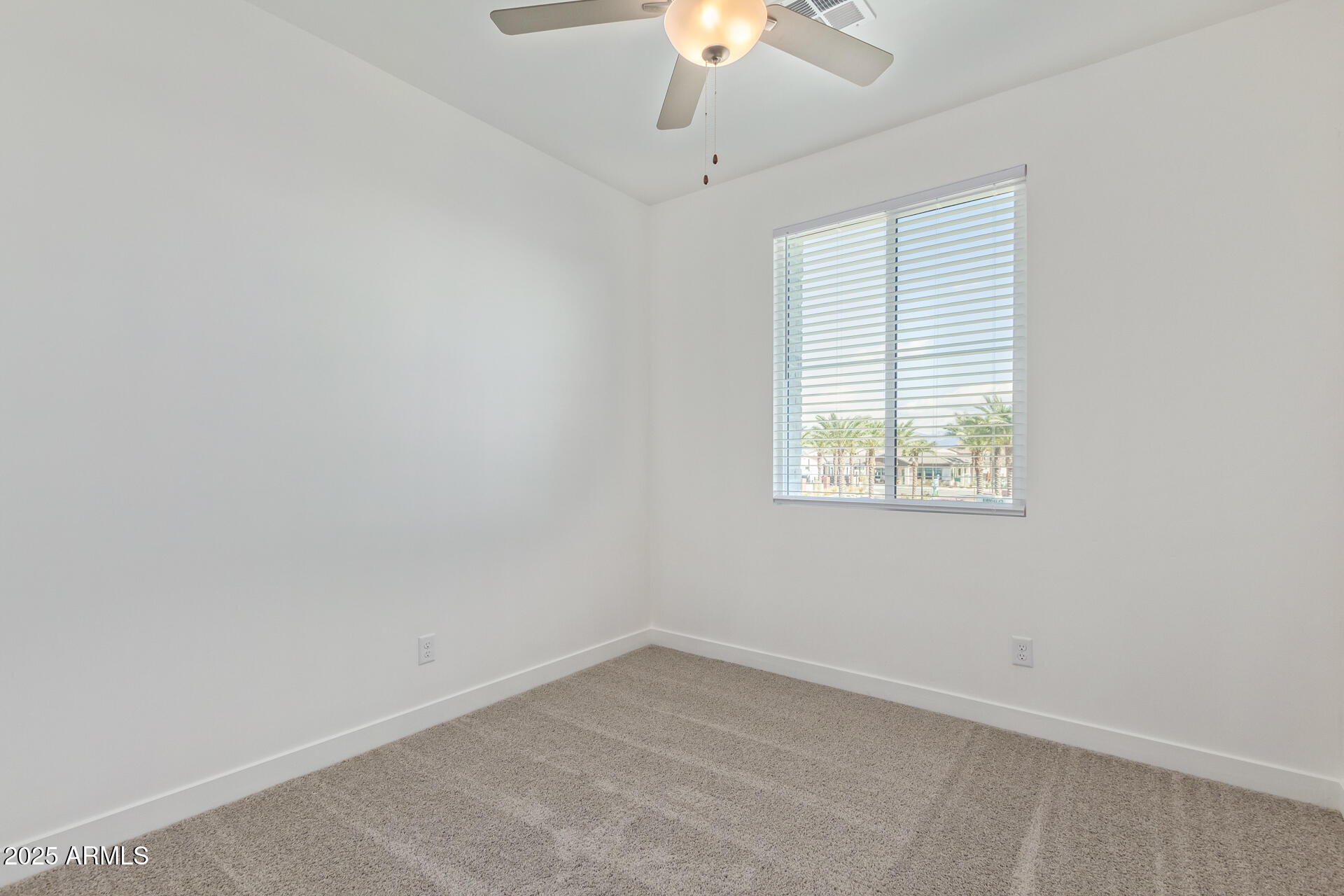 3230 East Thomas Road, Unit 184 Mesa, AZ 85213 - Photo 21 of 30 an empty room with a window