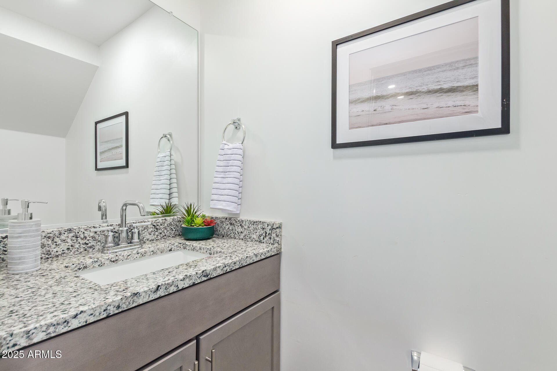 3230 East Thomas Road, Unit 184 Mesa, AZ 85213 - Photo 24 of 30 a bathroom with a granite countertop sink and a mirror
