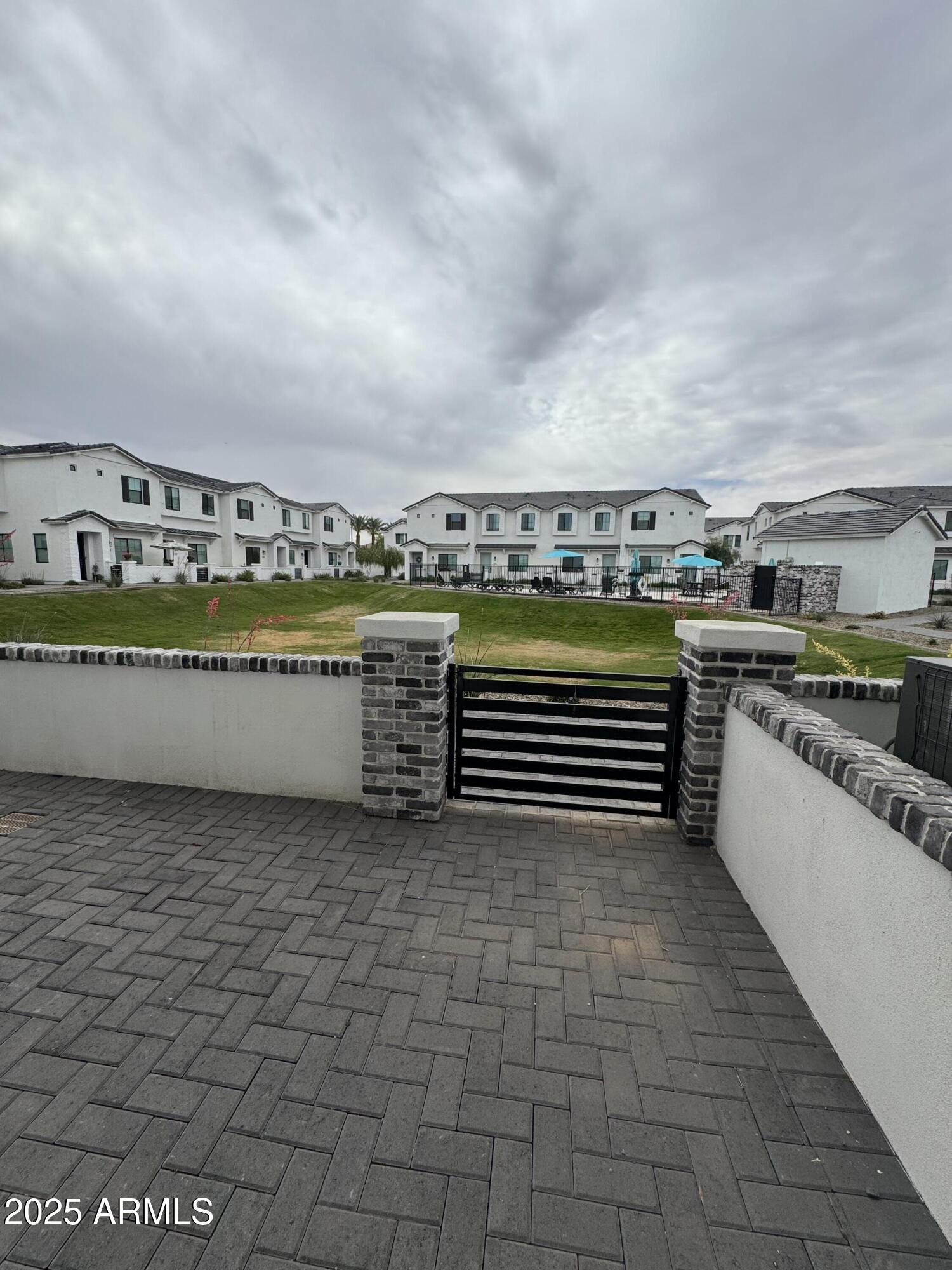 3230 East Thomas Road, Unit 184 Mesa, AZ 85213 - Photo 3 of 30 a view of a large pool and an outdoor seating