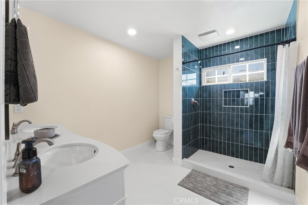 329 Catalpa Avenue Brea, CA 92821 - Photo 13 of 27 Primary En Suite has tile flooring, large walk-in shower, dual sinks and is bright and airy!
