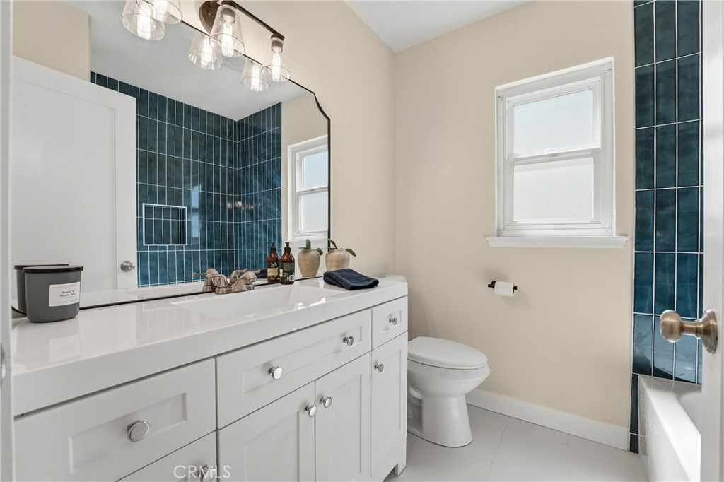 329 Catalpa Avenue Brea, CA 92821 - Photo 18 of 27 Hallway Bathroom has tile flooring, tub/shower combo, large vanity area, and lots of natural light.