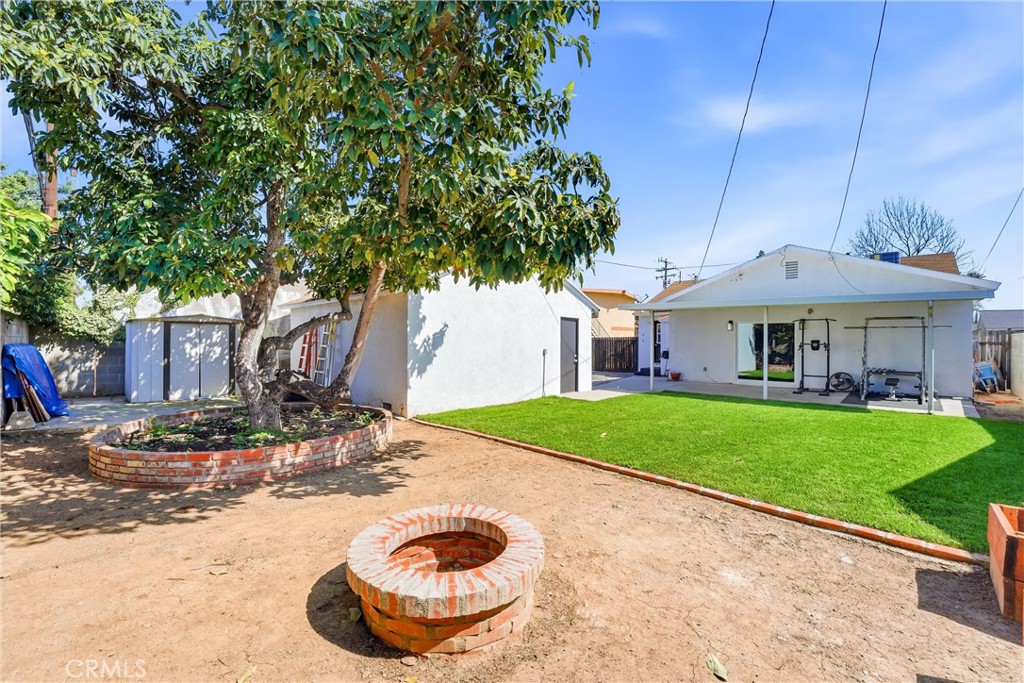 329 Catalpa Avenue Brea, CA 92821 - Photo 22 of 27 Great sitting area with firepit, mature trees, and views of the back of the home!