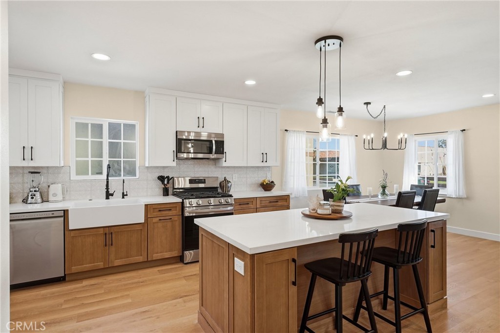 329 Catalpa Avenue Brea, CA 92821 - Photo 7 of 27 Recessed lighting, farm house kitchen sink, custom tile backsplash, and tons of natural light!