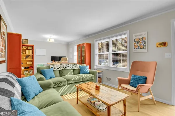 a living room with furniture and a window