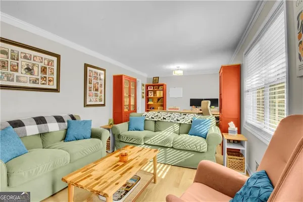 a living room with furniture and a large window