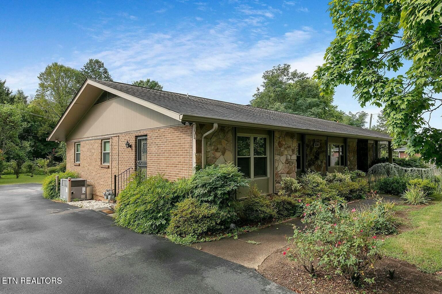 714 Broome Road Northwest, Unit B Knoxville, TN 37909 - Photo 1 of 10 a view of a house with backyard and garden