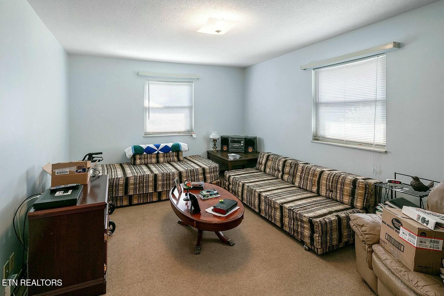 714 Broome Road Northwest, Unit B Knoxville, TN 37909 - Photo 9 of 10 a living room with furniture and a window
