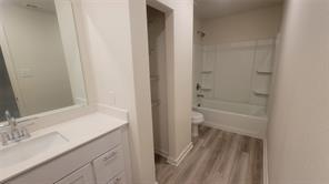 315 Marsh Lane Princeton, TX 75407 - Photo 11 of 20 a bathroom with a granite countertop sink toilet and shower