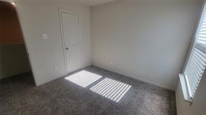 315 Marsh Lane Princeton, TX 75407 - Photo 14 of 20 a view of an empty room and wooden floor