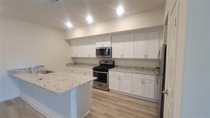 315 Marsh Lane Princeton, TX 75407 - Photo 20 of 20 a kitchen with a sink stove and refrigerator