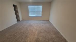 315 Marsh Lane Princeton, TX 75407 - Photo 7 of 20 an empty room with windows