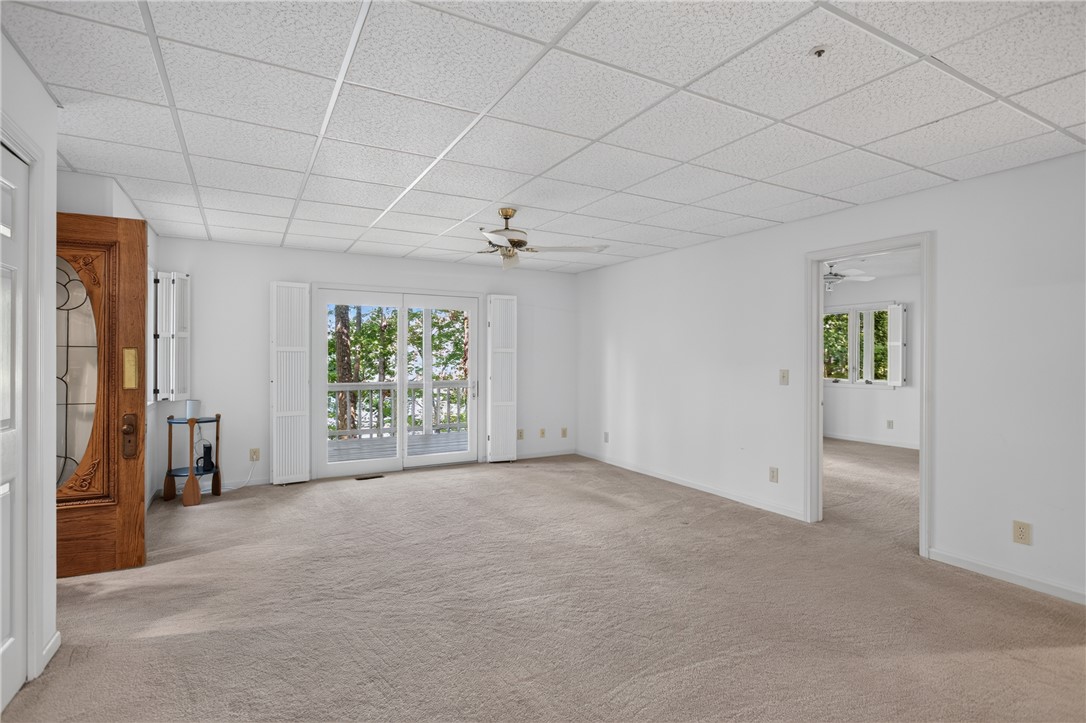 12 Lookout Lane Salem, SC 29676 - Photo 31 of 47 Downstairs 2nd living area with exterior access to lower covered deck