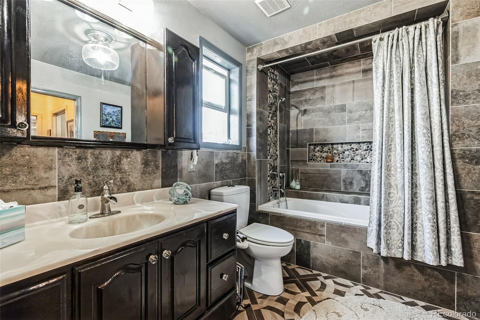 7882 Combs Road Fort Garland, CO 81133 - Photo 15 of 43 a bathroom with a sink and a mirror