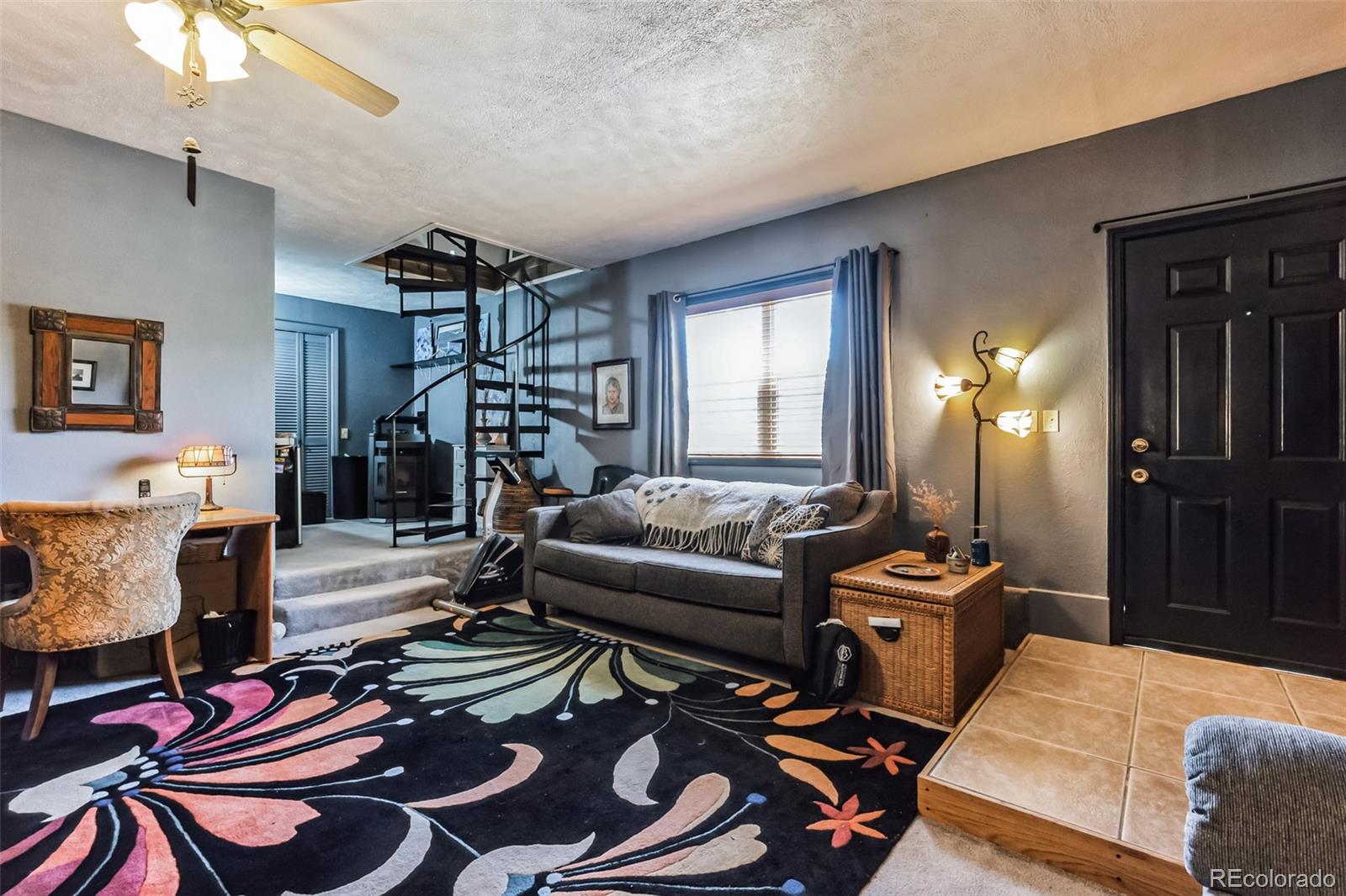 7882 Combs Road Fort Garland, CO 81133 - Photo 21 of 43 a living room with furniture a dining table and a chandelier