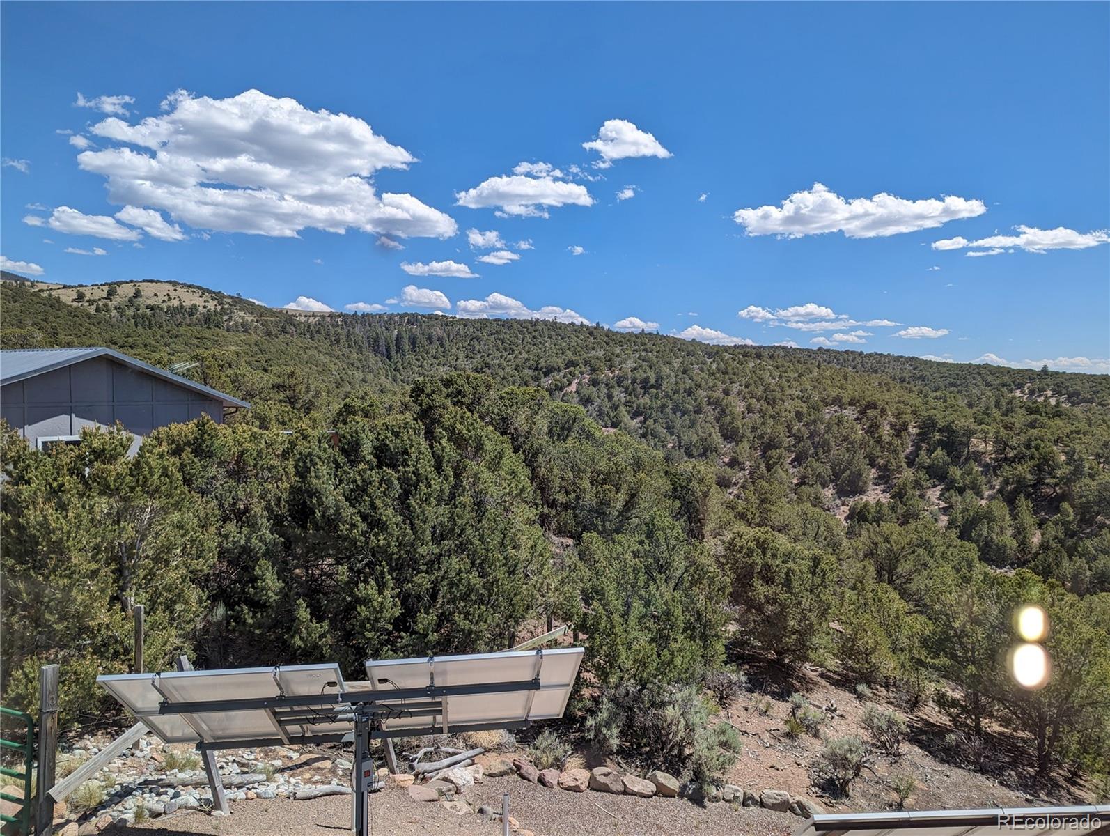 7882 Combs Road Fort Garland, CO 81133 - Photo 32 of 43 a view of a yard with an outdoor space and seating