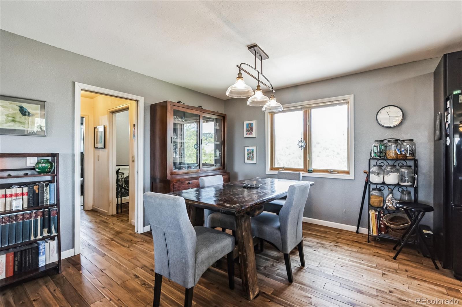 7882 Combs Road Fort Garland, CO 81133 - Photo 10 of 43 a view of a dining room with furniture window and wooden floor