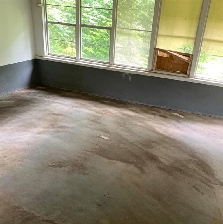 411 Stiles Road Selma, AL 36701 - Photo 2 of 7 a view of an empty room with a window
