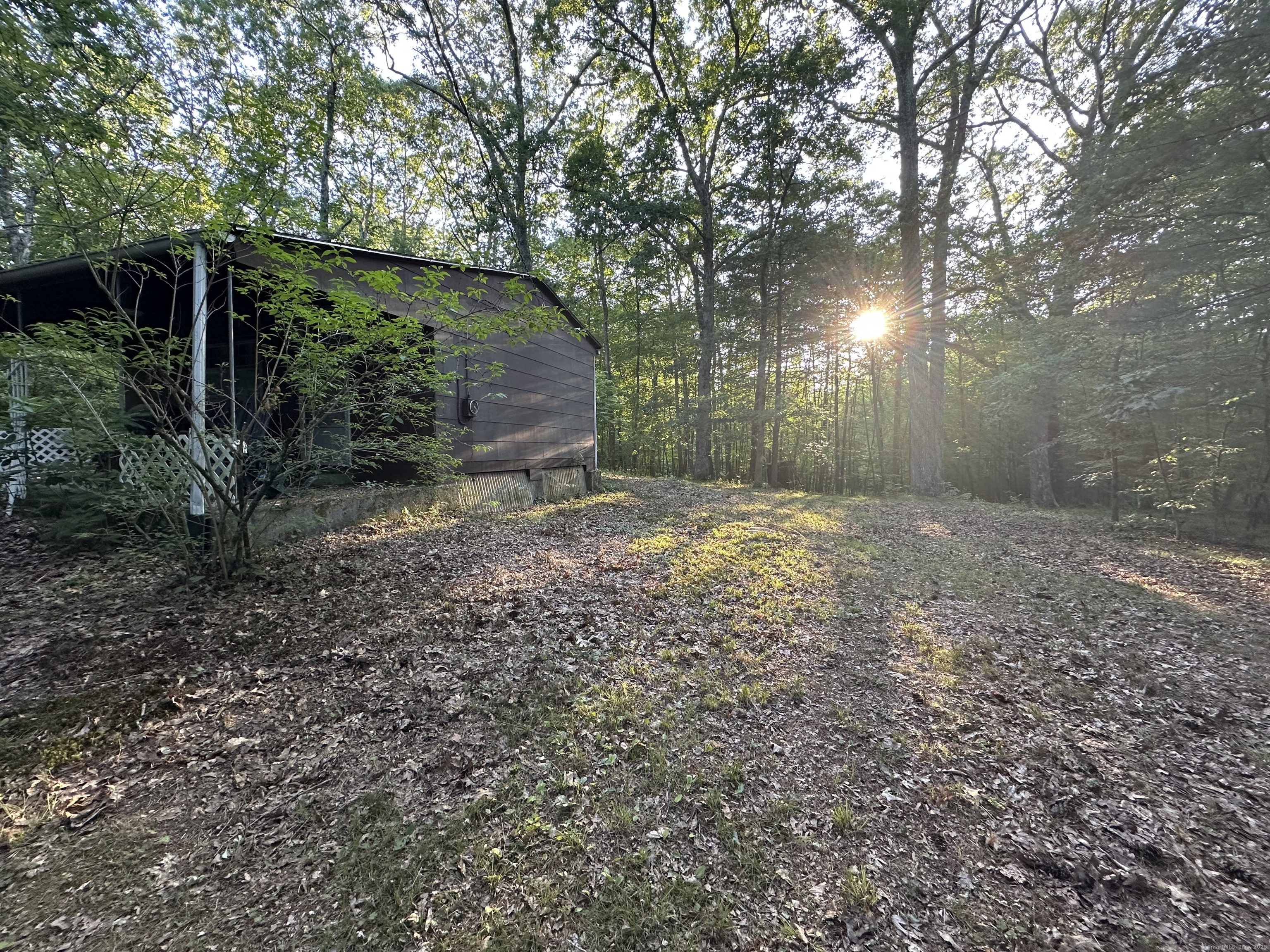 19 Potter Road Stafford, CT 06076 - Photo 2 of 18 a backyard of a house with lots of green space