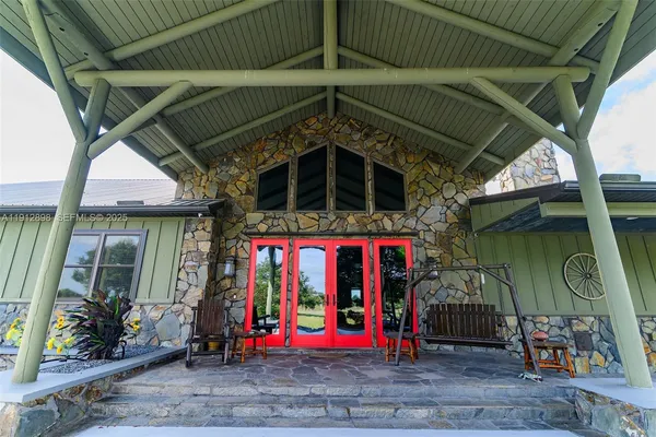 a view of house with outdoor seating space