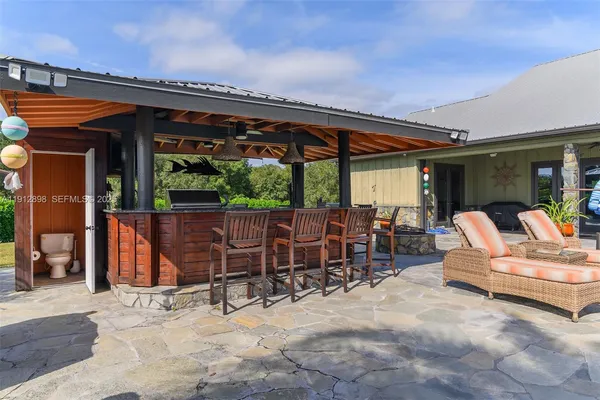 a view of a chairs and table in the patio