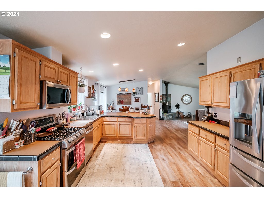 11035 Winstanley Lyons Or 97358 Lyons, OR 97358 - Photo 12 of 31 a large kitchen with stainless steel appliances lots of counter top space
