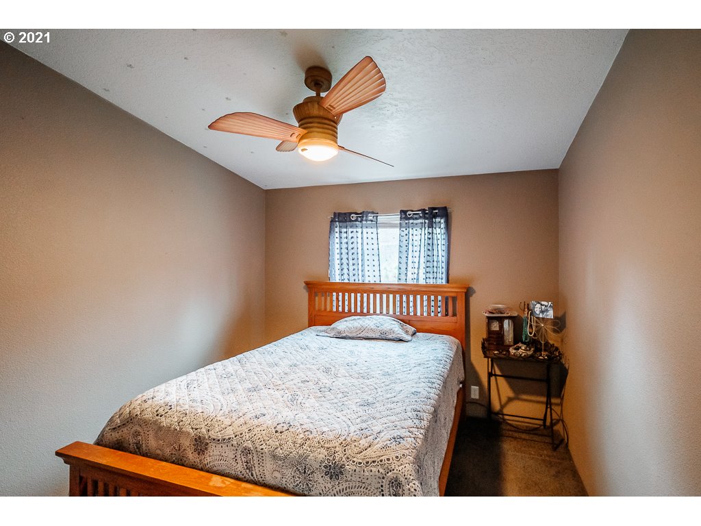 11035 Winstanley Lyons Or 97358 Lyons, OR 97358 - Photo 16 of 31 a bedroom with a bed and window