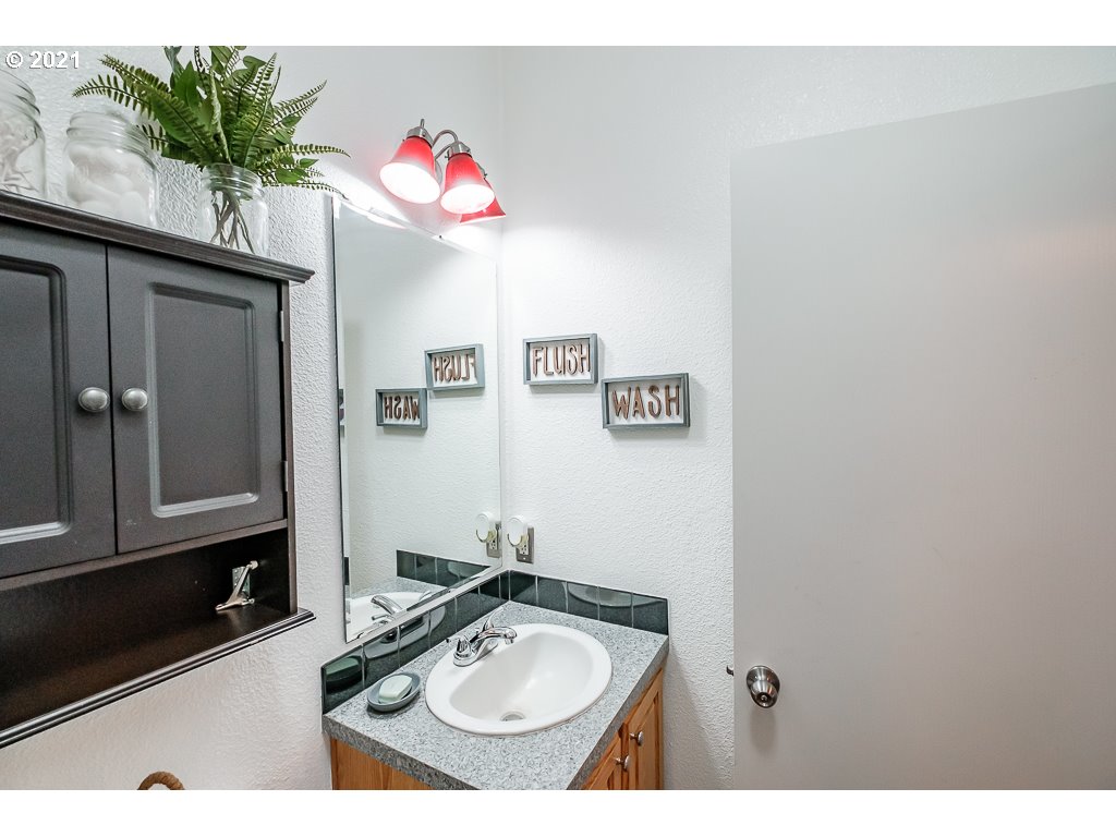 11035 Winstanley Lyons Or 97358 Lyons, OR 97358 - Photo 21 of 31 a bathroom with a sink vanity and a mirror