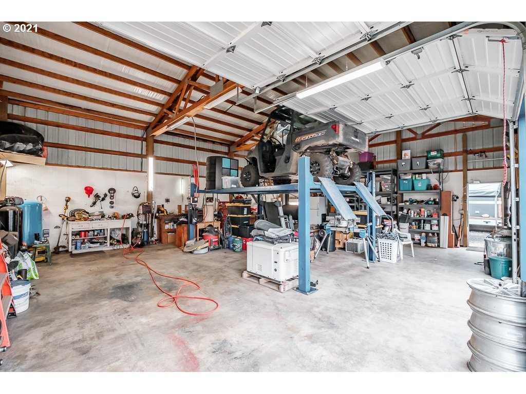 11035 Winstanley Lyons Or 97358 Lyons, OR 97358 - Photo 24 of 31 a view of a garage with a bike and a garage