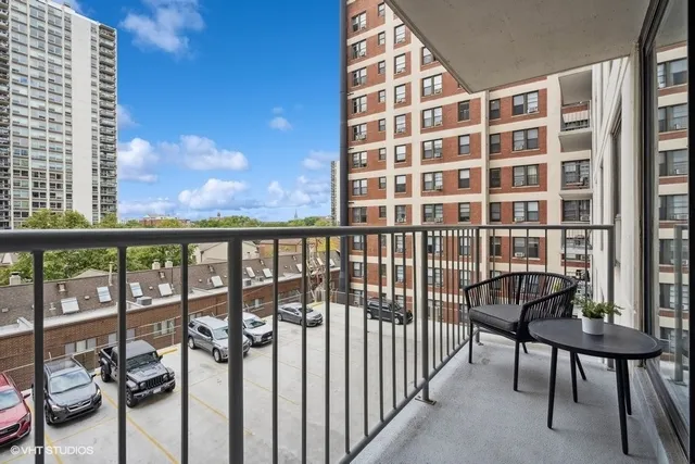 a view of a balcony with chairs
