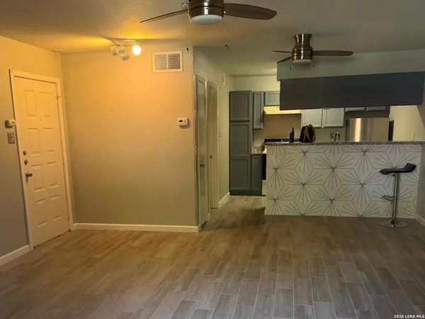 a view of a storage & utility room with wooden floor