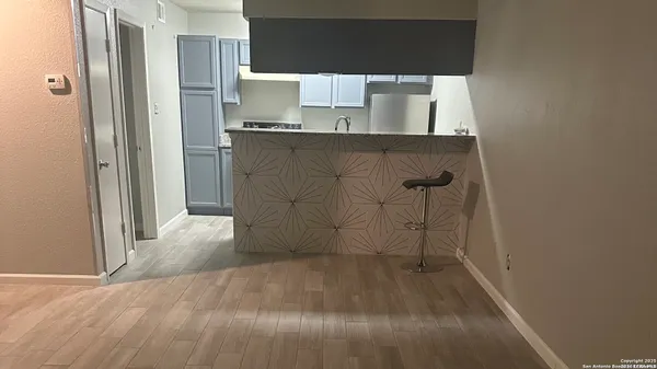 a view of a kitchen with a sink