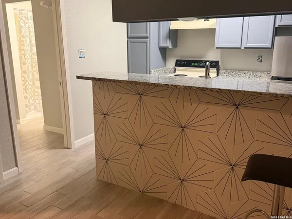 a kitchen with a sink and cabinets