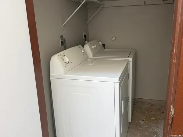 a utility room with dryer and washer