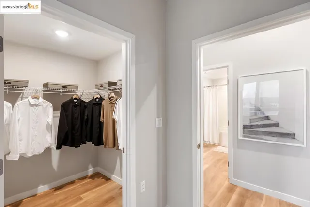 a bedroom with a bed and lamps