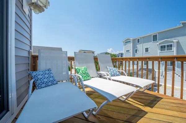 a view of a patio with wooden floor