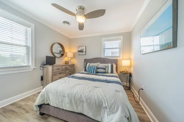 a spacious bedroom with a bed a window and closet