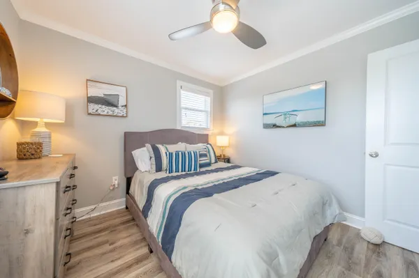 a bed room with a bed and a painting