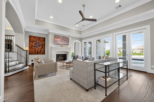 a large white kitchen with lots of counter space dining table and chairs
