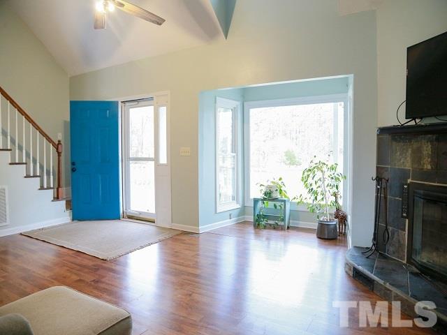 2300 Rolesville Road Wake Forest, NC 27587 - Photo 3 of 24 a view of a livingroom with furniture and a flat screen tv