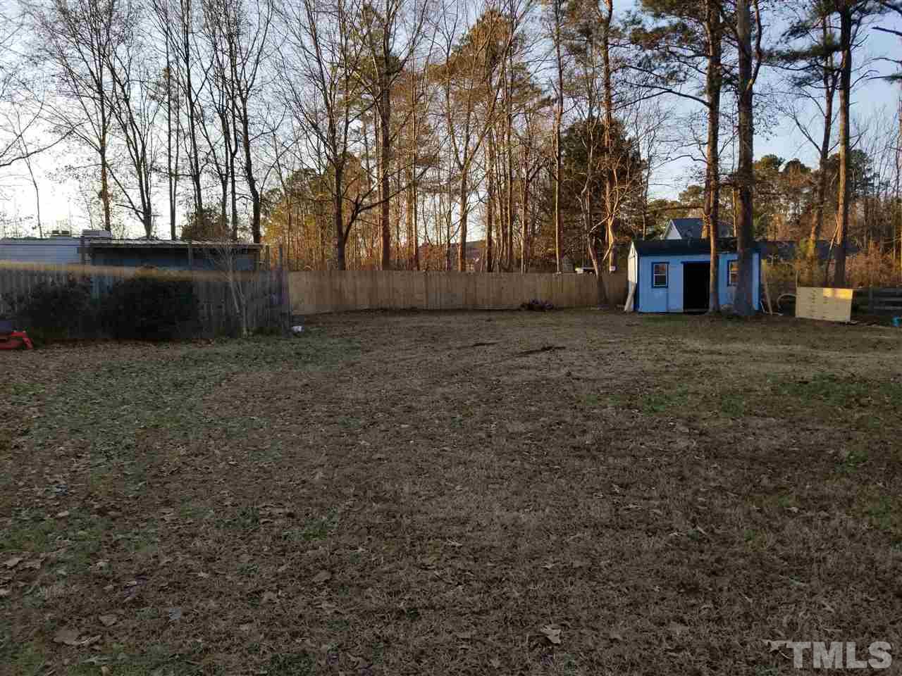 2300 Rolesville Road Wake Forest, NC 27587 - Photo 23 of 24 a view of a backyard with large trees